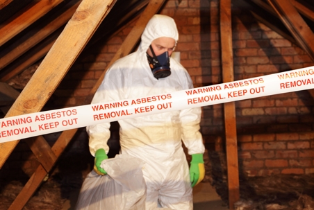 Man removing asbestos.